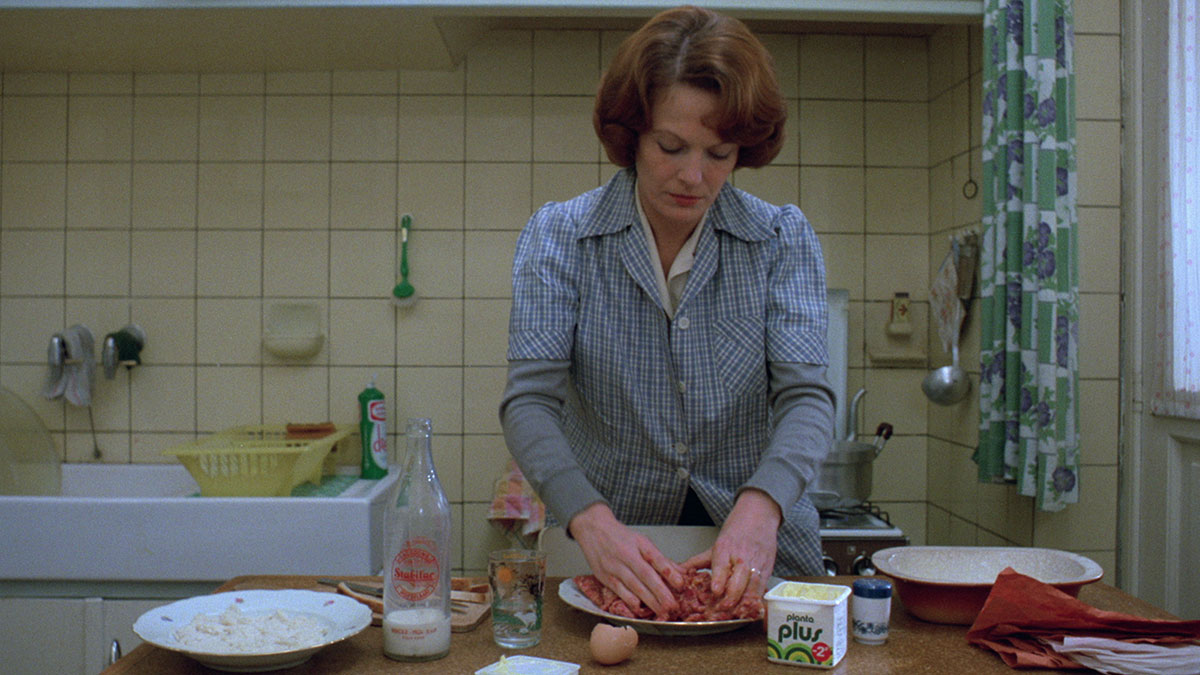 In Chantal Akerman’s <em>Jeanne Dielman, 23, quai du Commerce, 1080 Bruxelles</em> (1975), we observe Dielman, in her pallid baby-blue apron, fold and press a mound of meatloaf that’s as pliable as Play-Doh.