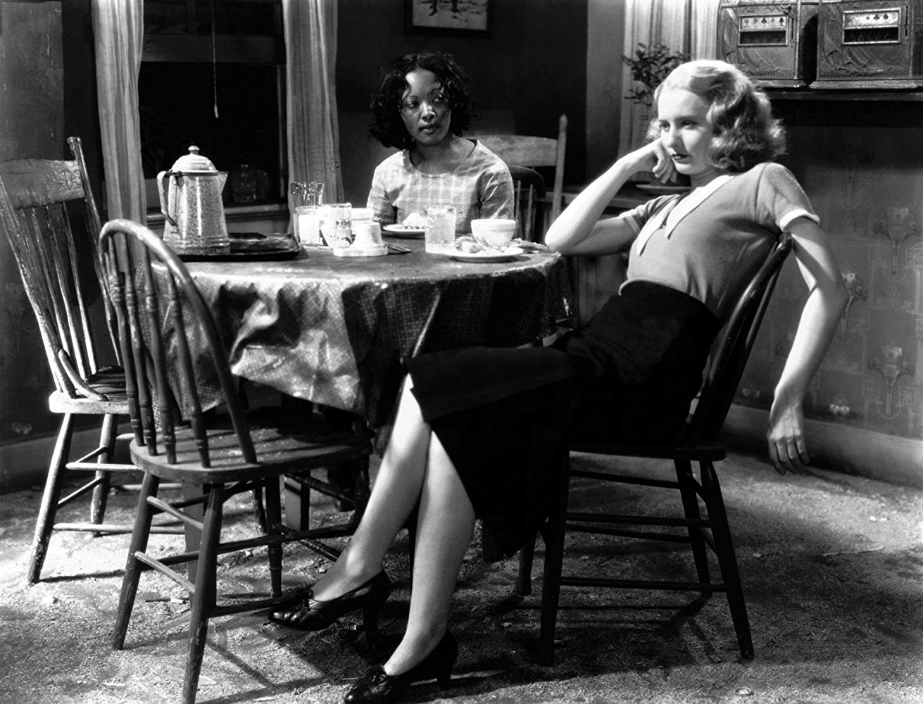 Barbara Stanwyck with Theresa Harris in <em>Baby Face</em> (1933). 