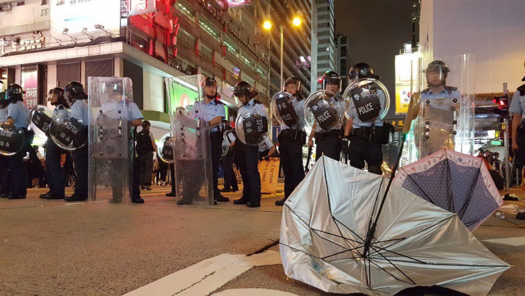 Hong Kong police officers photographed in July 2019. Photo courtesy: Tom Grundy / <em>Hong Kong Free Press</em>.