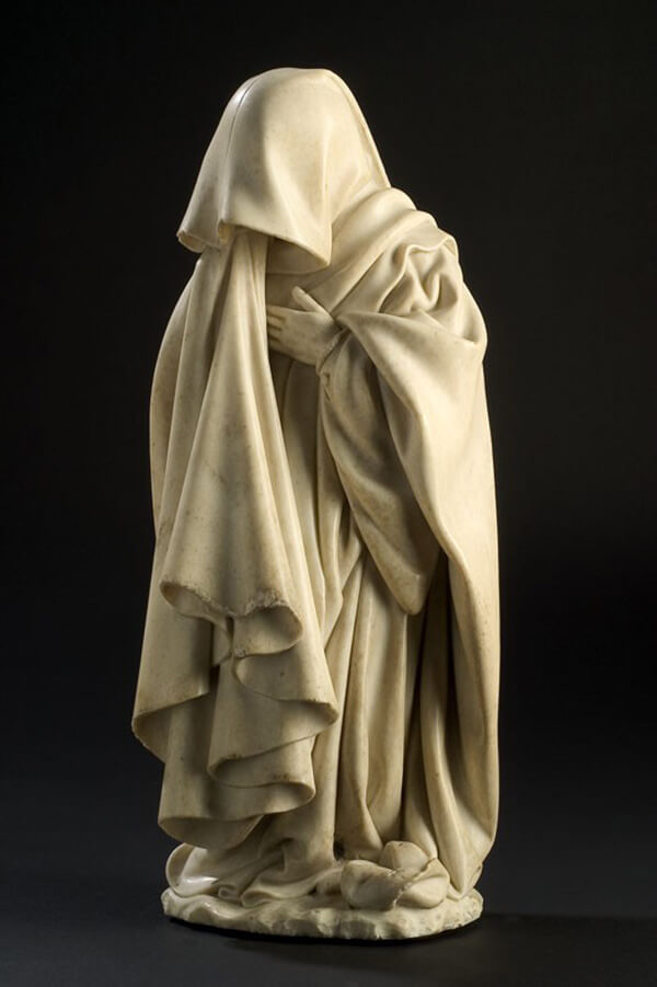 Jean de la Huerta and Antoine le Moiturier, <em>Mourner with Drawn Hood</em>, 1443-57, alabaster. Image courtesy of the Musée des Beaux-Arts, Dijon.